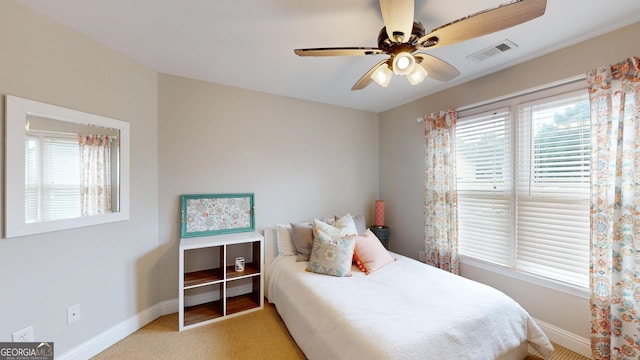 1346 Wind Chime Ct, Lawrenceville, GA 30045 - bedroom featuring baseboards, multiple windows, a ceiling fan, and light colored carpet