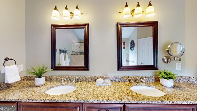 1346 Wind Chime Ct, Lawrenceville, GA 30045 - bathroom featuring double vanity and a shower