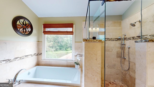 1346 Wind Chime Ct, Lawrenceville, GA 30045 - bathroom featuring a bath, a walk in shower, and a wainscoted wall