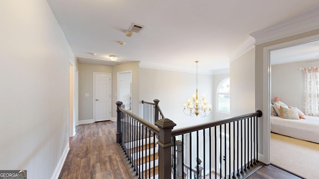 1346 Wind Chime Ct, Lawrenceville, GA 30045 - corridor with an upstairs landing, dark wood-style floors, a chandelier, baseboards, and crown molding
