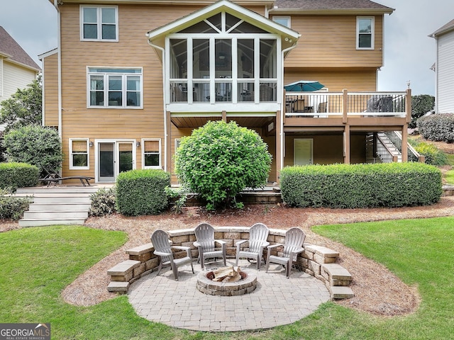 1346 Wind Chime Ct, Lawrenceville, GA 30045 - back of property with stairway, an outdoor fire pit, a patio area, a deck, and a lawn