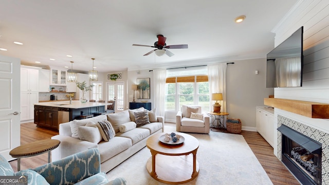 1346 Wind Chime Ct, Lawrenceville, GA 30045 - living room with a fireplace, wood finished floors, ceiling fan, recessed lighting, and baseboards