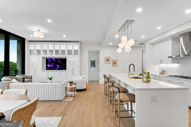 2425 Peachtree Rd NE Unit 902, Atlanta, GA 30305 - living room featuring light wood-type flooring, floor to ceiling windows, and recessed lighting