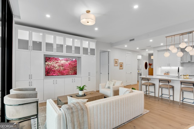 2425 Peachtree Rd NE Unit 902, Atlanta, GA 30305 - living area featuring light wood-type flooring and recessed lighting