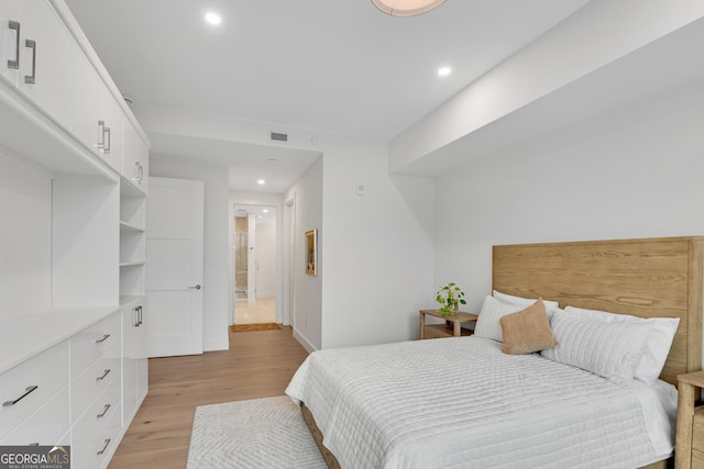 2425 Peachtree Rd NE Unit 902, Atlanta, GA 30305 - bedroom with light wood finished floors and recessed lighting