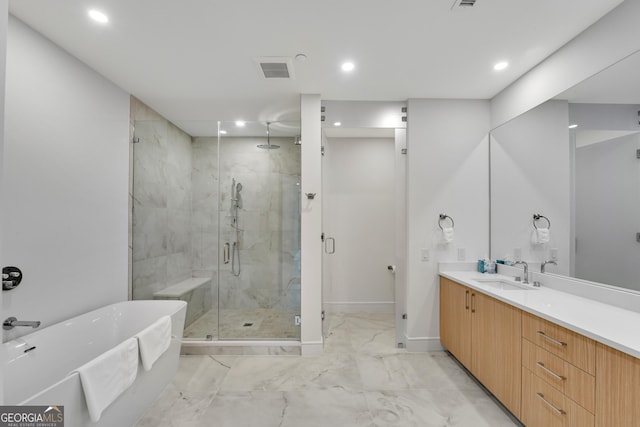 2425 Peachtree Rd NE Unit 902, Atlanta, GA 30305 - full bath featuring a marble finish shower, a soaking tub, marble finish floors, vanity, and recessed lighting