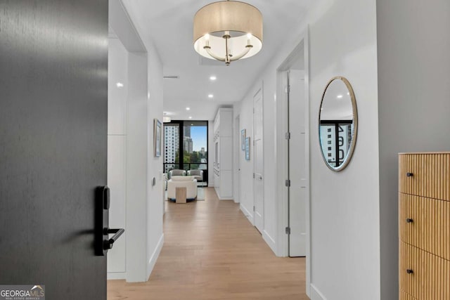 2425 Peachtree Rd NE Unit 902, Atlanta, GA 30305 - hall featuring light wood-style flooring and recessed lighting