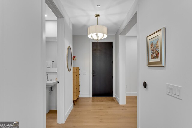 2425 Peachtree Rd NE Unit 902, Atlanta, GA 30305 - hall with light wood-style flooring and baseboards