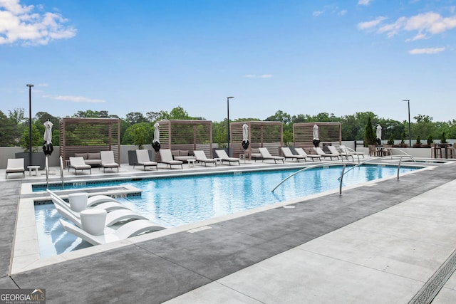 2425 Peachtree Rd NE Unit 902, Atlanta, GA 30305 - community pool featuring a patio area
