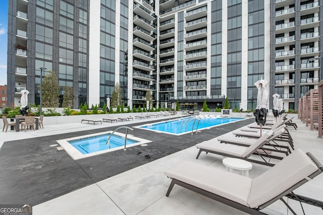 2425 Peachtree Rd NE Unit 902, Atlanta, GA 30305 - community pool featuring a hot tub and a patio area
