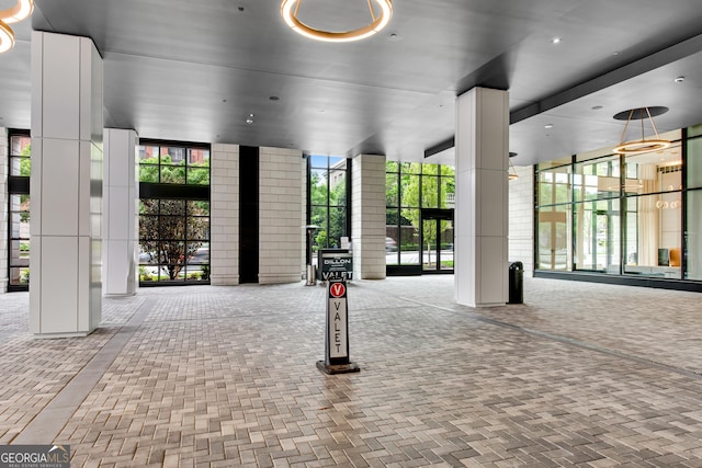 2425 Peachtree Rd NE Unit 902, Atlanta, GA 30305 - view of home's community featuring expansive windows and decorative columns