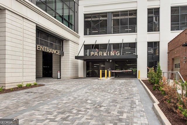 2425 Peachtree Rd NE Unit 902, Atlanta, GA 30305 - view of exterior entry featuring decorative driveway
