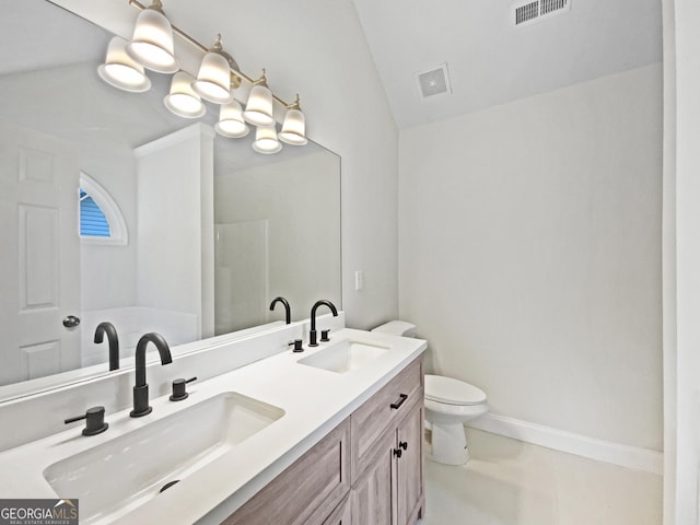 1792 Portwest Way, Hampton, GA 30228 - bathroom featuring double vanity and vaulted ceiling