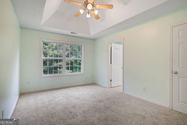 135 Pinewood Cir, Colbert, GA 30628 - carpeted empty room featuring a tray ceiling and a ceiling fan