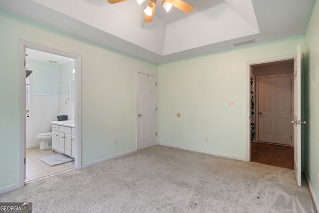 135 Pinewood Cir, Colbert, GA 30628 - unfurnished bedroom with light carpet, a raised ceiling, and connected bathroom