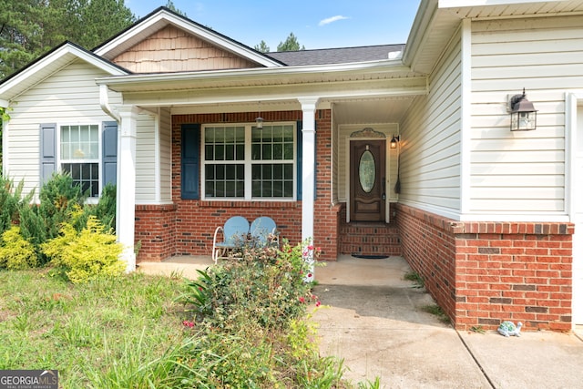 135 Pinewood Cir, Colbert, GA 30628 - property entrance featuring brick siding and covered porch
