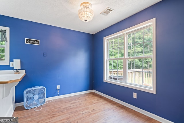 135 Pinewood Cir, Colbert, GA 30628 - unfurnished office featuring wood finished floors and a textured ceiling