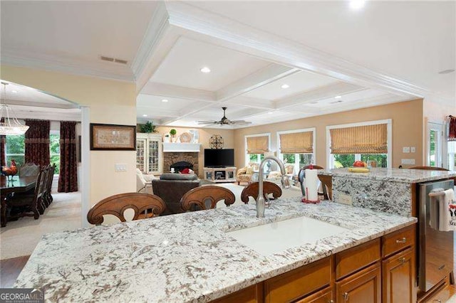 7131 Ridge Rd, Hiram, GA 30141 - kitchen with a ceiling fan, coffered ceiling, healthy amount of natural light, beam ceiling, and light stone countertops