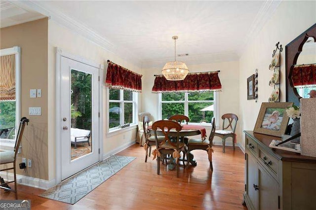 7131 Ridge Rd, Hiram, GA 30141 - dining space featuring ornamental molding, wood finished floors, and a chandelier