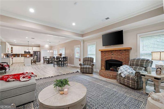 7131 Ridge Rd, Hiram, GA 30141 - living room with light wood-style flooring, ornamental molding, recessed lighting, and a fireplace