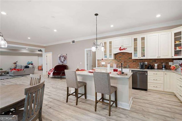7131 Ridge Rd, Hiram, GA 30141 - kitchen with dishwashing machine, open floor plan, light wood-style flooring, ornamental molding, and a kitchen bar