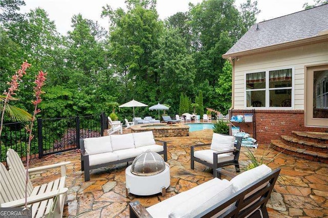 7131 Ridge Rd, Hiram, GA 30141 - view of patio / terrace featuring an outdoor living space with a fire pit, an outdoor pool, and view of wooded area