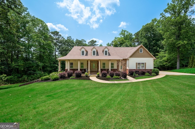 7131 Ridge Rd, Hiram, GA 30141 - cape cod-style house with a porch, a front lawn, and brick siding