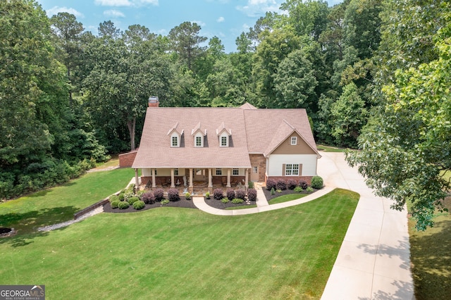 7131 Ridge Rd, Hiram, GA 30141 - new england style home featuring covered porch, driveway, a front yard, and a chimney