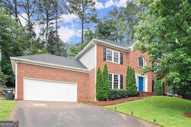 4213 Schooner Ct NE, Roswell, GA 30075 - view of front of home featuring concrete driveway, a front yard, brick siding, and an attached garage