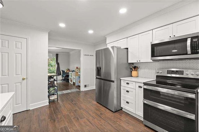 4213 Schooner Ct NE, Roswell, GA 30075 - kitchen featuring stainless steel appliances, crown molding, light countertops, white cabinets, and recessed lighting