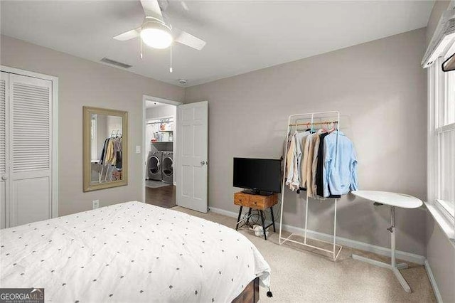 4213 Schooner Ct NE, Roswell, GA 30075 - bedroom with independent washer and dryer, a closet, light colored carpet, and ceiling fan