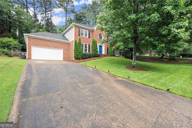 4213 Schooner Ct NE, Roswell, GA 30075 - colonial home with driveway, brick siding, a front yard, and an attached garage