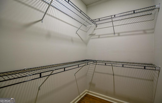 5640 Redan Cir, Stone Mountain, GA 30088 - spacious closet with dark wood-style flooring