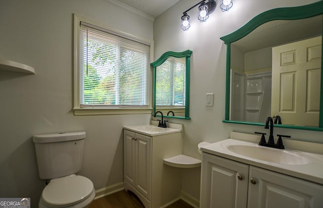5640 Redan Cir, Stone Mountain, GA 30088 - full bath with vanity, toilet, crown molding, baseboards, and a textured ceiling