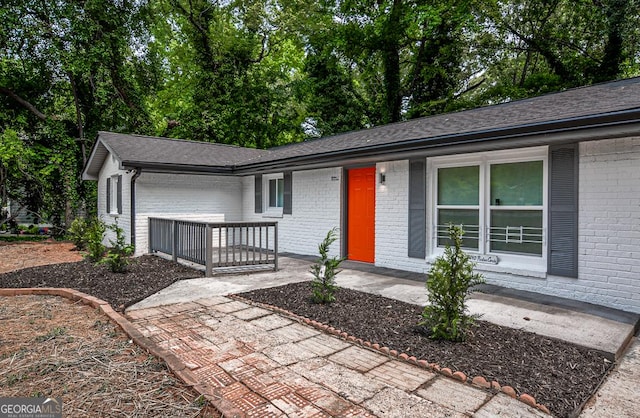 5640 Redan Cir, Stone Mountain, GA 30088 - view of front facade with brick siding and an attached garage