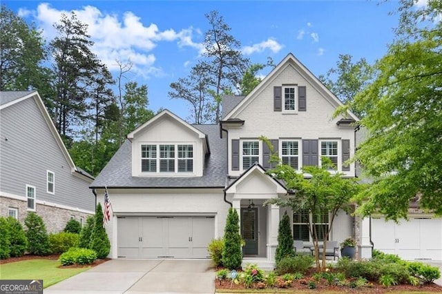 124 Calder Dr, Alpharetta, GA 30009 - traditional-style house with concrete driveway, an attached garage, and a shingled roof