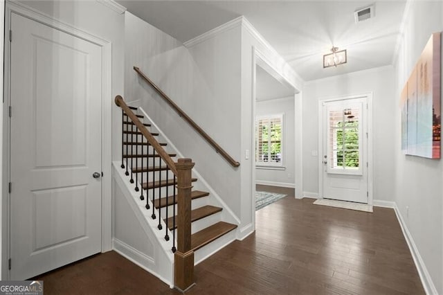 124 Calder Dr, Alpharetta, GA 30009 - foyer with crown molding, dark wood-type flooring, stairs, and baseboards