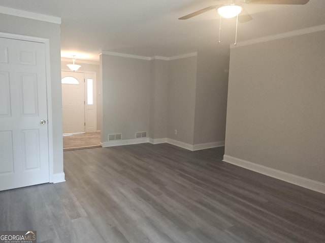 686 Favorwood Dr SW, Marietta, GA 30060 - spare room with ceiling fan, dark wood-style floors, ornamental molding, and baseboards