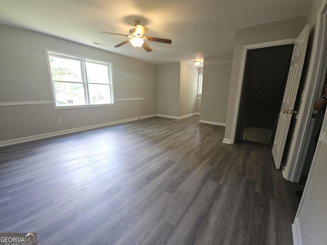 686 Favorwood Dr SW, Marietta, GA 30060 - spare room featuring a ceiling fan, dark wood-style flooring, and baseboards