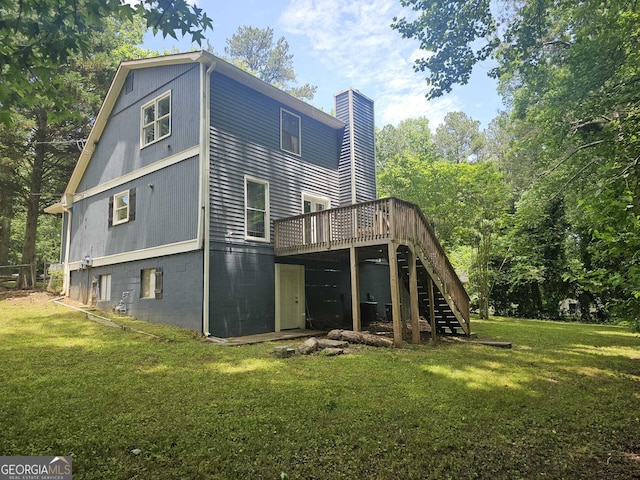 686 Favorwood Dr SW, Marietta, GA 30060 - back of property with stairs, a chimney, a yard, and a deck