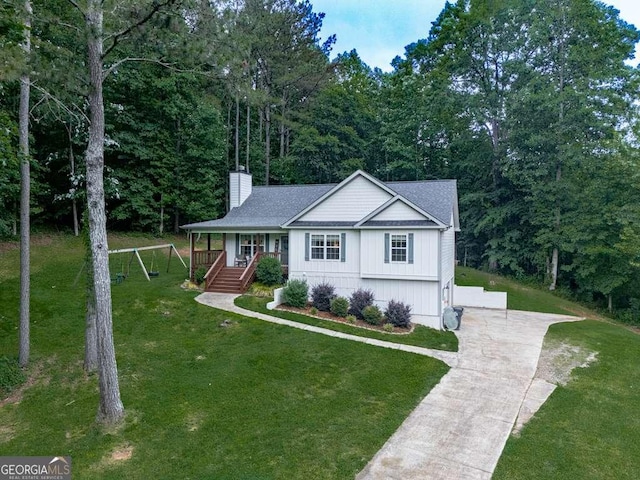 351 Danburg Ct, Jasper, GA 30143 - view of front facade featuring covered porch, concrete driveway, a chimney, a front yard, and a shingled roof