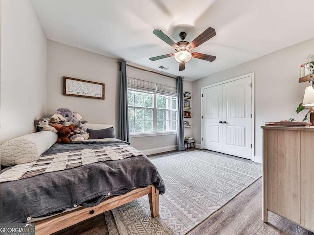 351 Danburg Ct, Jasper, GA 30143 - bedroom with wood finished floors, baseboards, a closet, and a ceiling fan