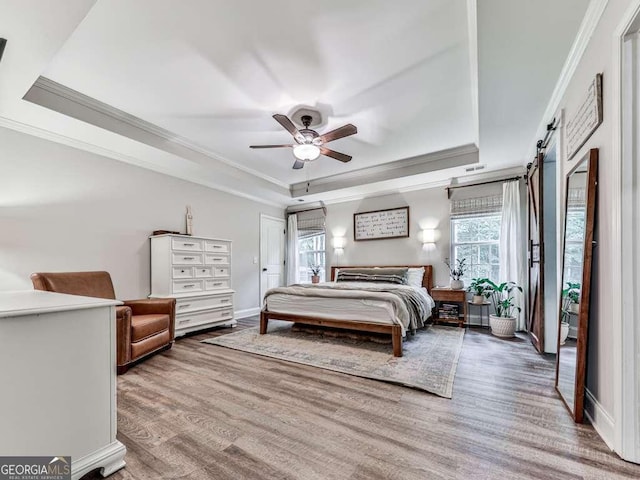 351 Danburg Ct, Jasper, GA 30143 - bedroom featuring a tray ceiling, crown molding, wood finished floors, baseboards, and a ceiling fan
