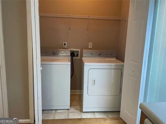 6634 Splashwater Dr, Flowery Branch, GA 30542 - laundry area featuring washing machine and dryer and light tile patterned flooring