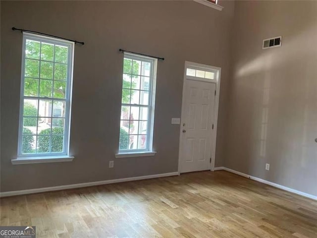 6634 Splashwater Dr, Flowery Branch, GA 30542 - entrance foyer with light wood-style flooring and baseboards