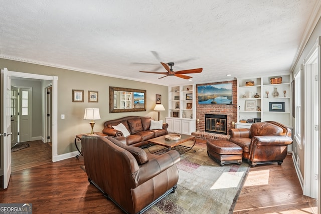 10875 Shagbark Trl, Roswell, GA 30075 - living room with a textured ceiling, a ceiling fan, dark wood-style flooring, a fireplace, and built in features