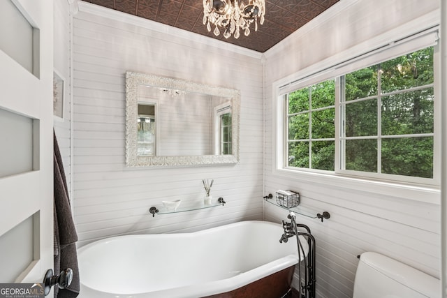 10875 Shagbark Trl, Roswell, GA 30075 - full bath featuring a soaking tub, an ornate ceiling, a chandelier, wood walls, and crown molding