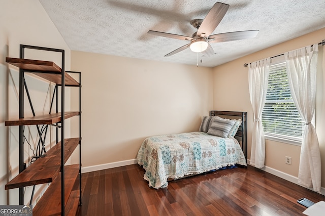 10875 Shagbark Trl, Roswell, GA 30075 - bedroom with a textured ceiling, wood finished floors, and ceiling fan