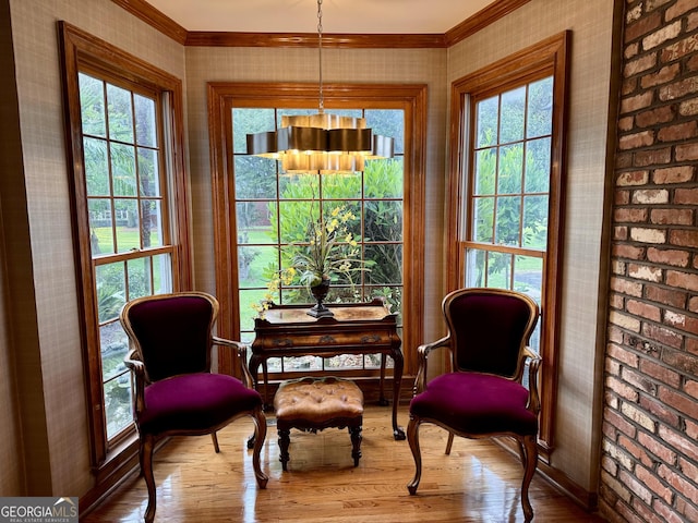 124 N Valhalla Ln, Cordele, GA 31015 - sitting room featuring wood finished floors, crown molding, wallpapered walls, and baseboards