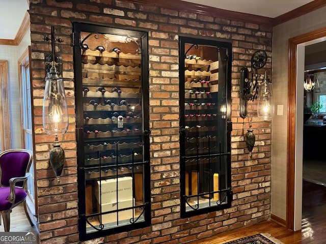 124 N Valhalla Ln, Cordele, GA 31015 - wine room featuring wood finished floors, crown molding, and baseboards